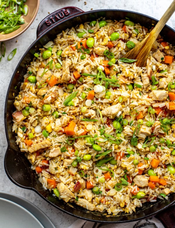 skillet with chicken fried rice and spoon