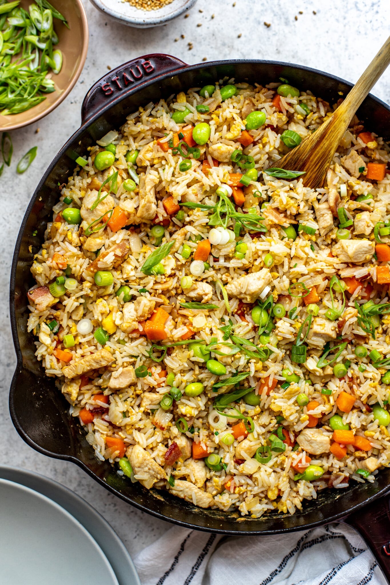 skillet with chicken fried rice and spoon