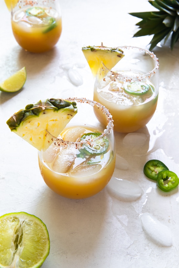 pineapple margaritas with a pineapple garnish