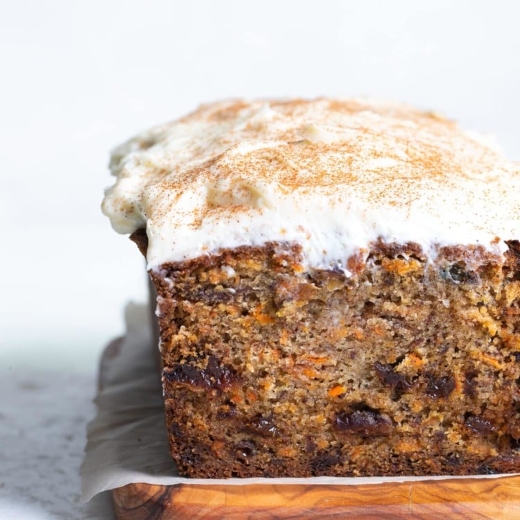 loaf of carrot cake with white glaze