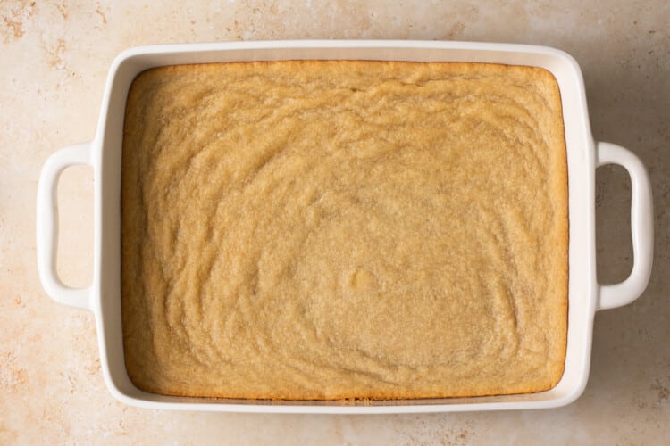 apple pie bars batter in a baking dish