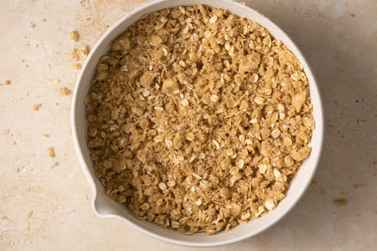oat layer of apple pie bars in a circle dish