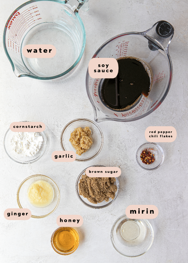 ingredients needed for teriyaki salmon in small glass bowls. 