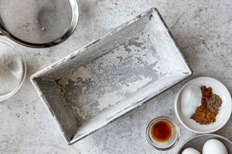 a loaf pan coated with flour.