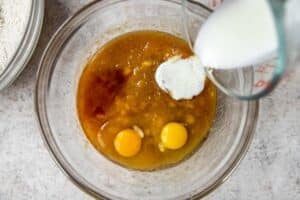 wet ingredients for banana bread in a large glass bowl.