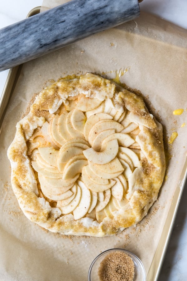 an apple galette on a baking sheet