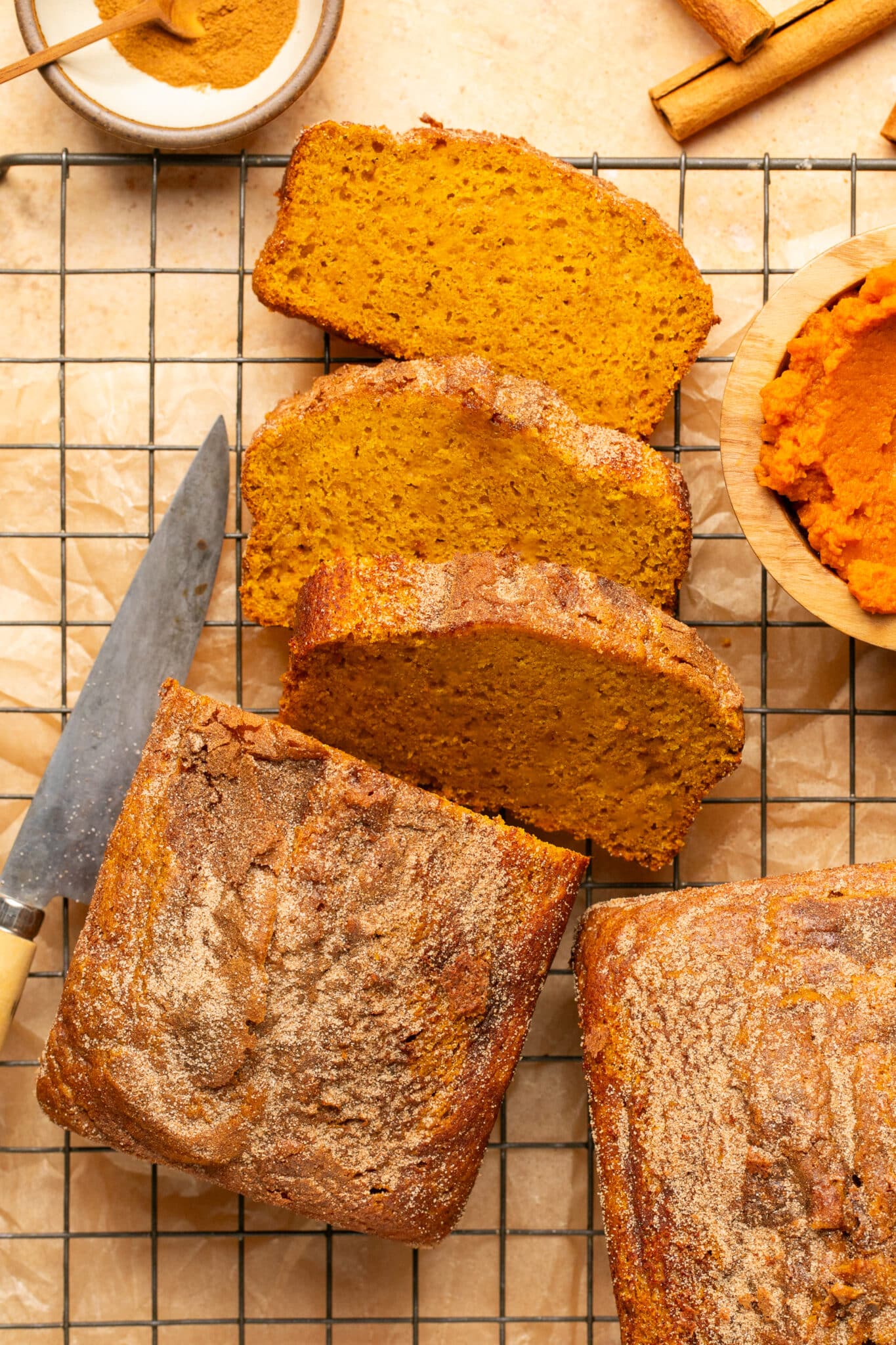 freshly baked pumpkin bread on a wire cooling rack. 