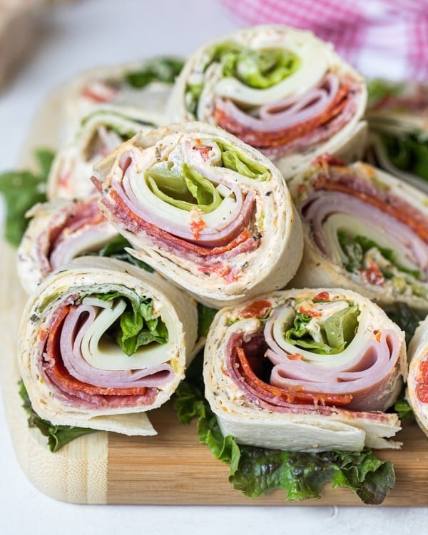 italian pinwheel sandwiches on a cutting board