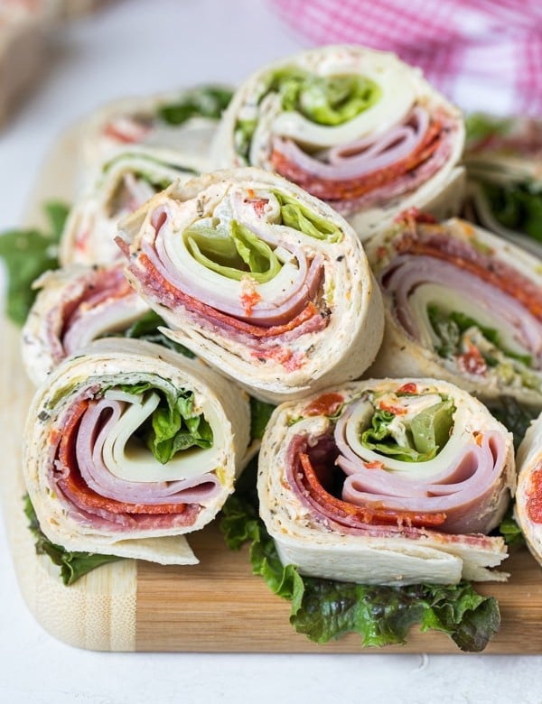 italian pinwheel sandwiches on a cutting board