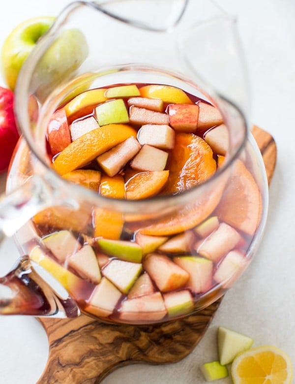 fall sangria in a glass pitcher