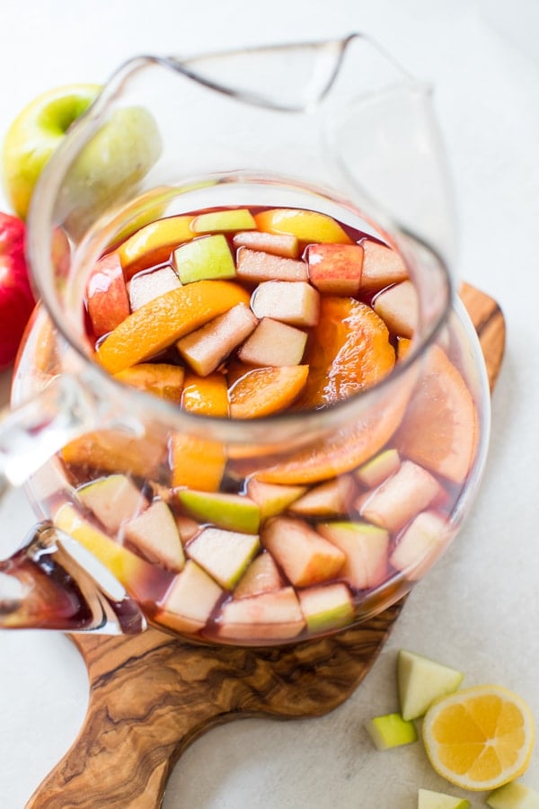fall sangria in a glass pitcher