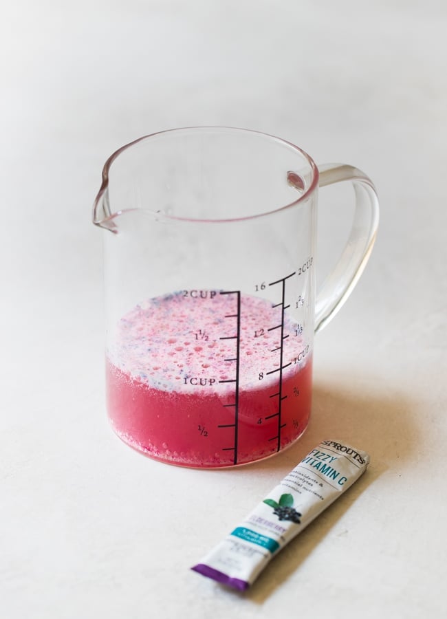 elderberry in a glass measuring cup