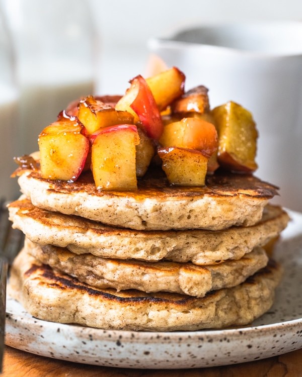 pancakes on a plate with apples on top