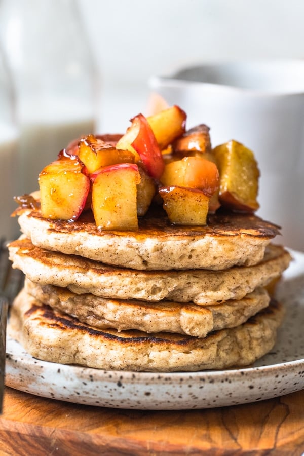 pancakes on a plate with apples on top