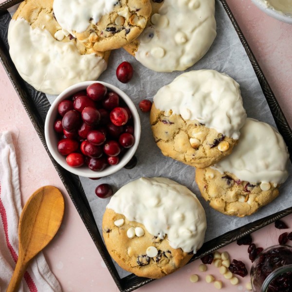 cookies on parchment paper dipped in white chocolate