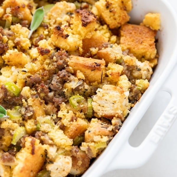 cornbread stuffing in a white baking dish