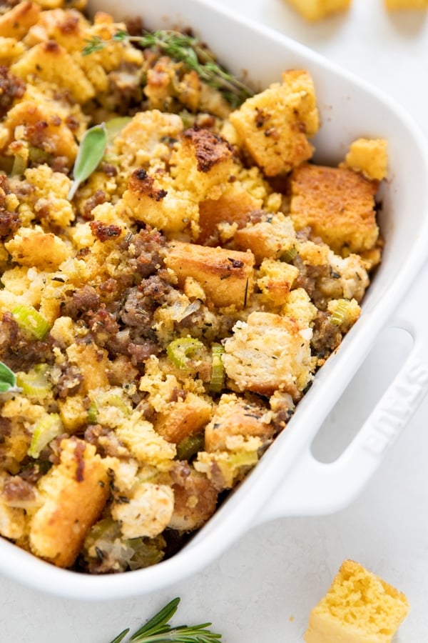 cornbread stuffing in a white baking dish