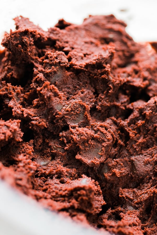 red velvet cookie dough in a glass bowl