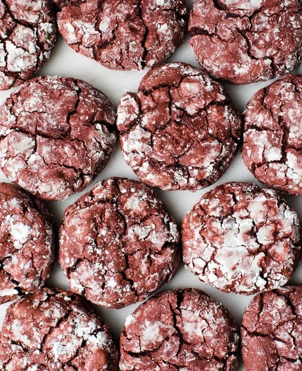 red velvet crinkle cookies on a marble board