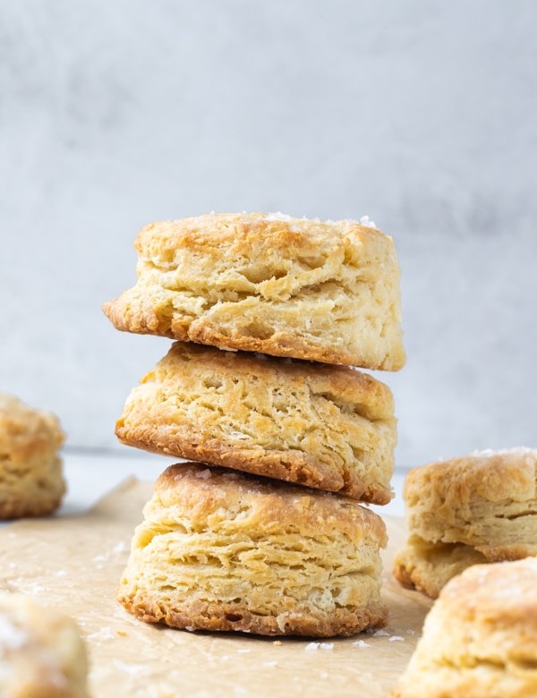 a stack of biscuits on parchment paper