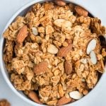 granola in a white bowl with almonds