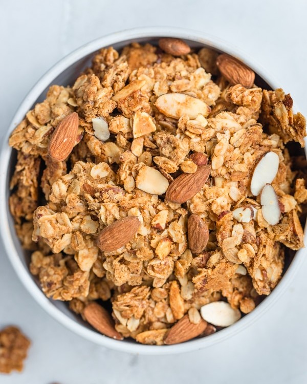 granola in a white bowl with almonds