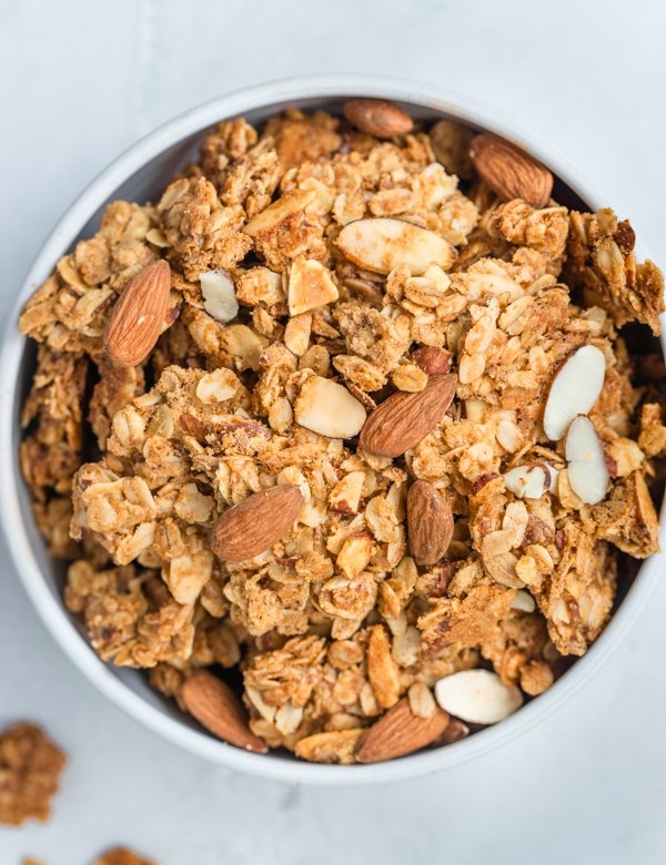 granola in a white bowl with almonds