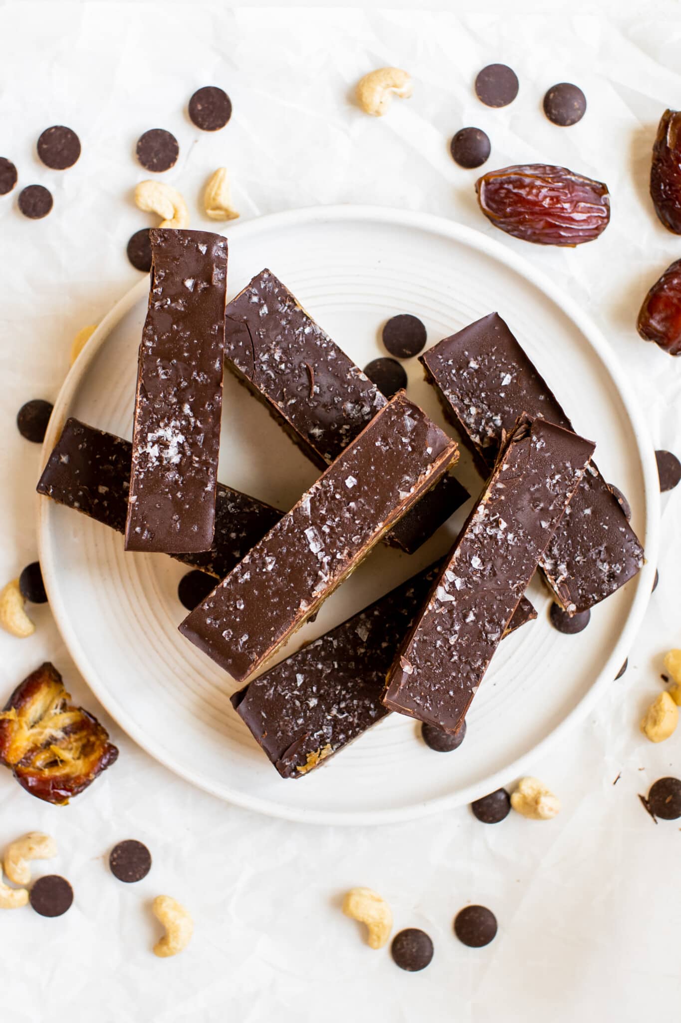 homemade protein bars stacked on a white plate