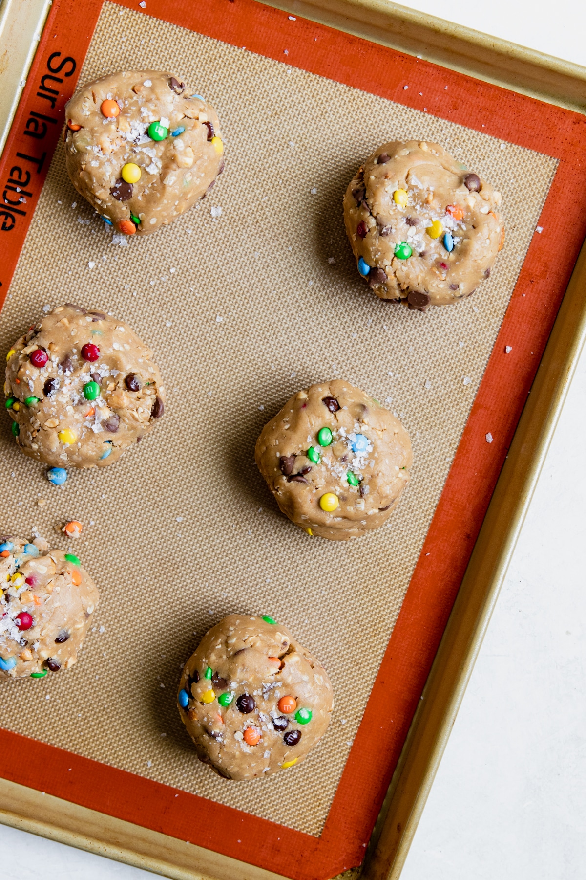 cookie dough balls on a baking sheet