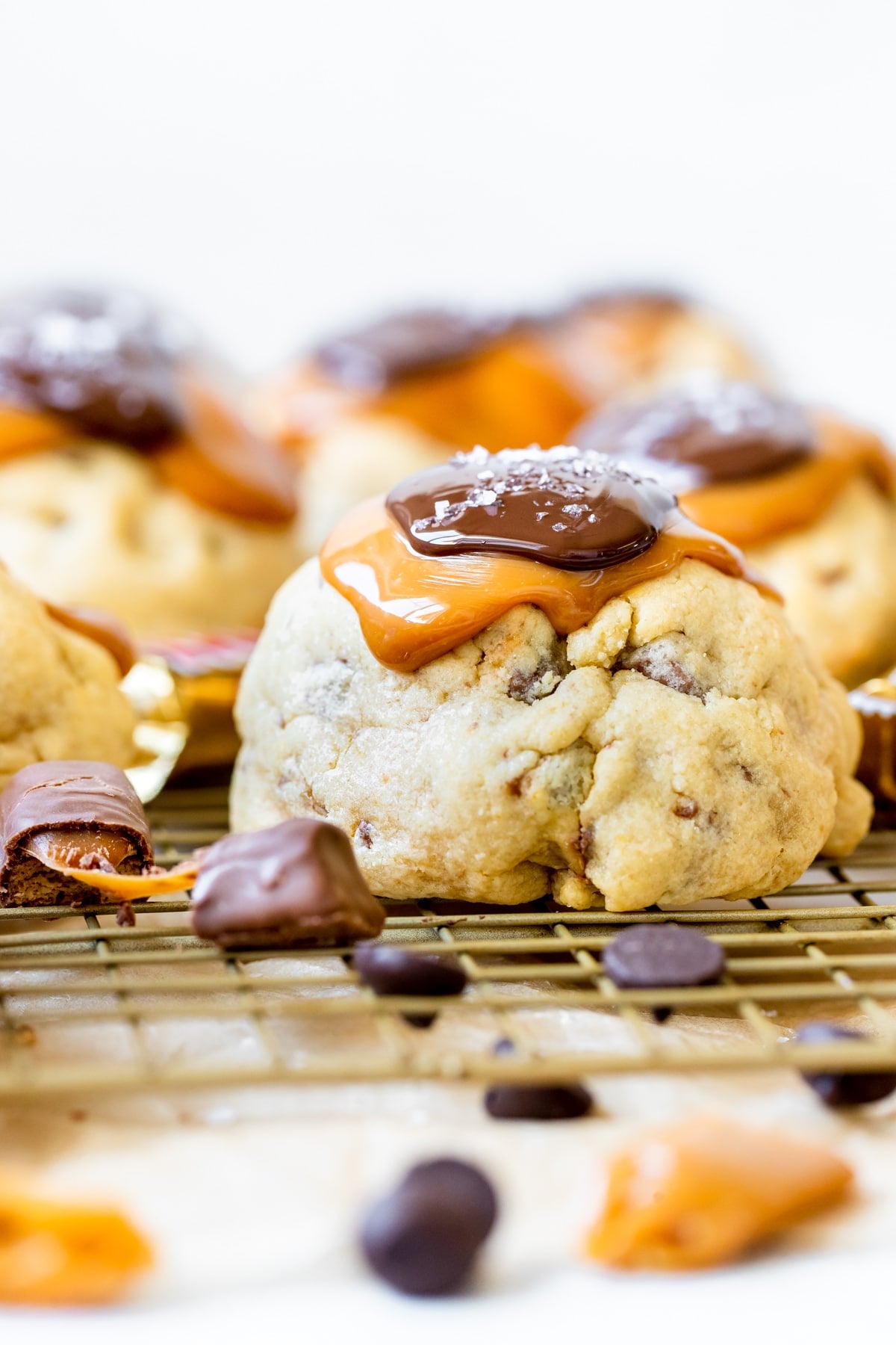 cookies topped with chocolate, caramel and sea salt