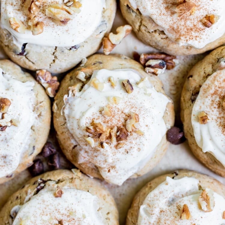 cookies made with bananas on parchment paper topped with walnuts and cinnamon