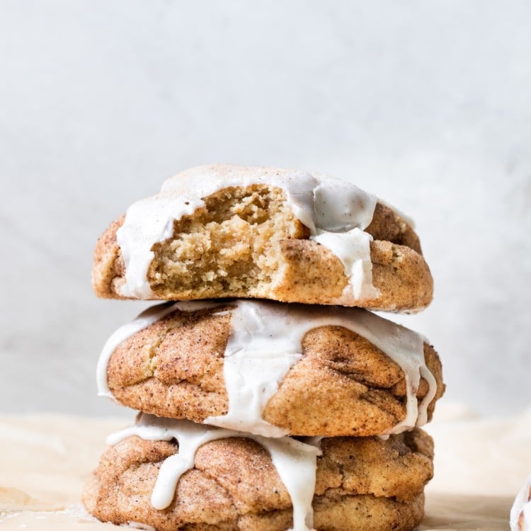 a chai cookies on parchment paper topped with vanilla bean glaze
