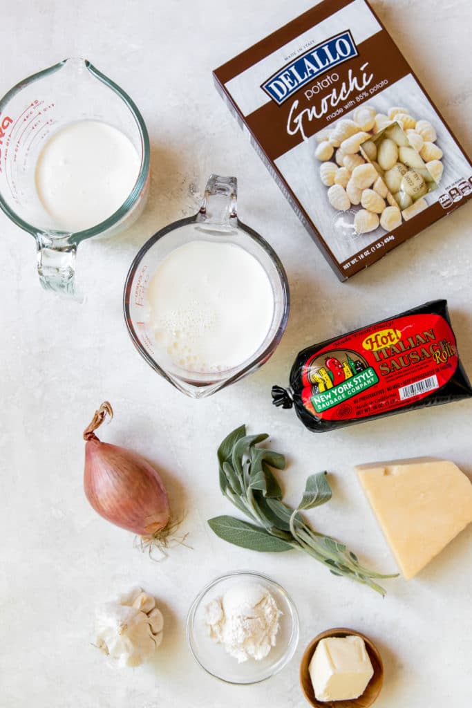 This Creamy Gnocchi Recipe is cozy, comforting and just so delicious. Made with a rich and creamy sauce, spicy Italian sausage, Parmesan cheese and fresh sage. It's a quick and easy weeknight dinner you'll love! #creamygnocchi #gnocchirecipes #easygnocchi #pastarecipes #gnocchidinner #creamypasta #italiansausage #krollskorner #weeknightdinner