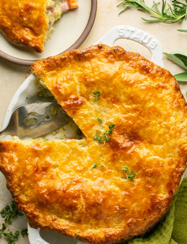 overhead shot of ham pot pie with one piece missing