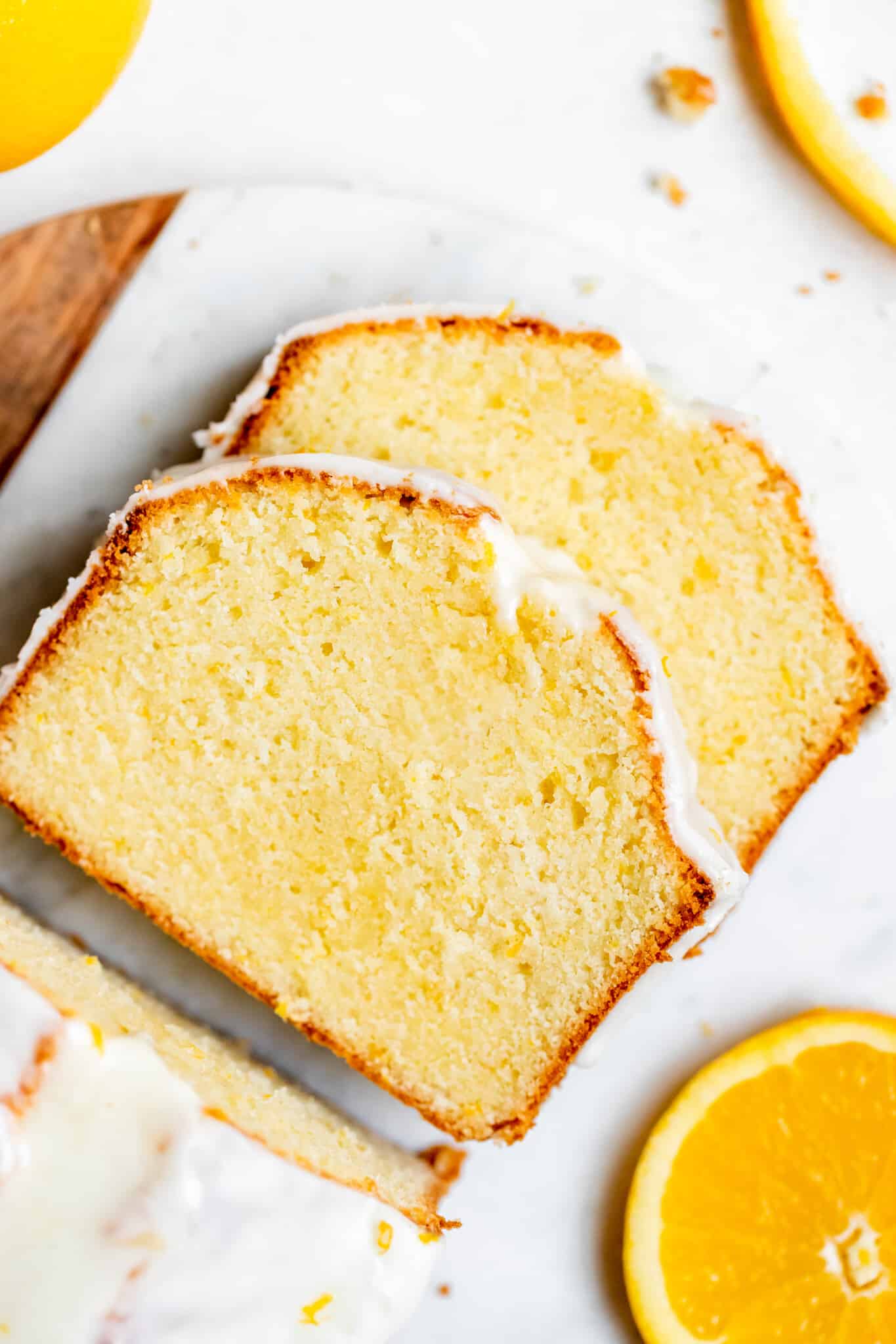 pound cake with a glaze on top on a marble board