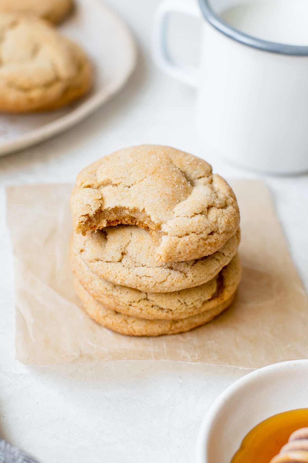 a stack of cookies with a bite taken out of one 