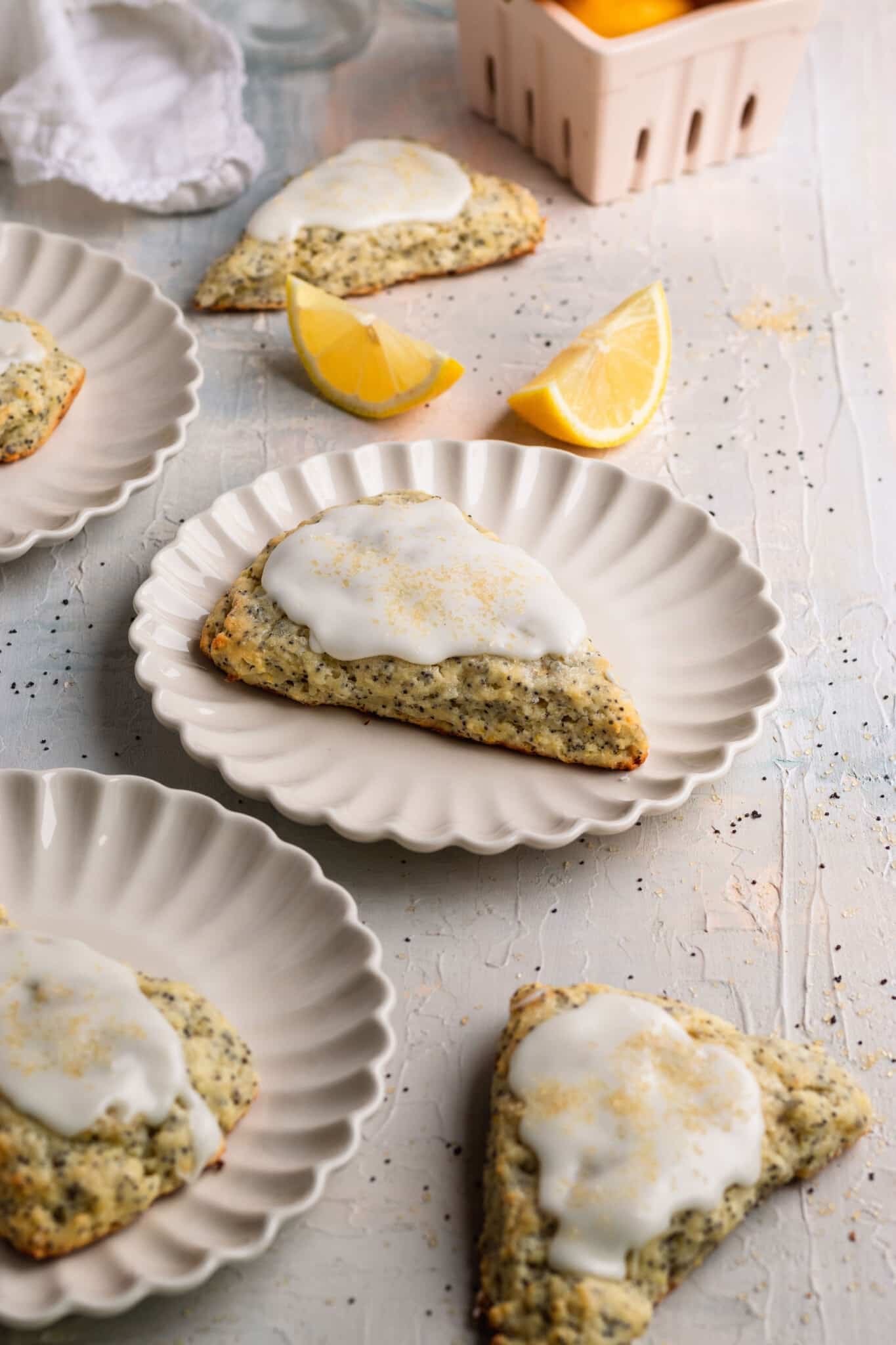 scones on white plates topped with glaze