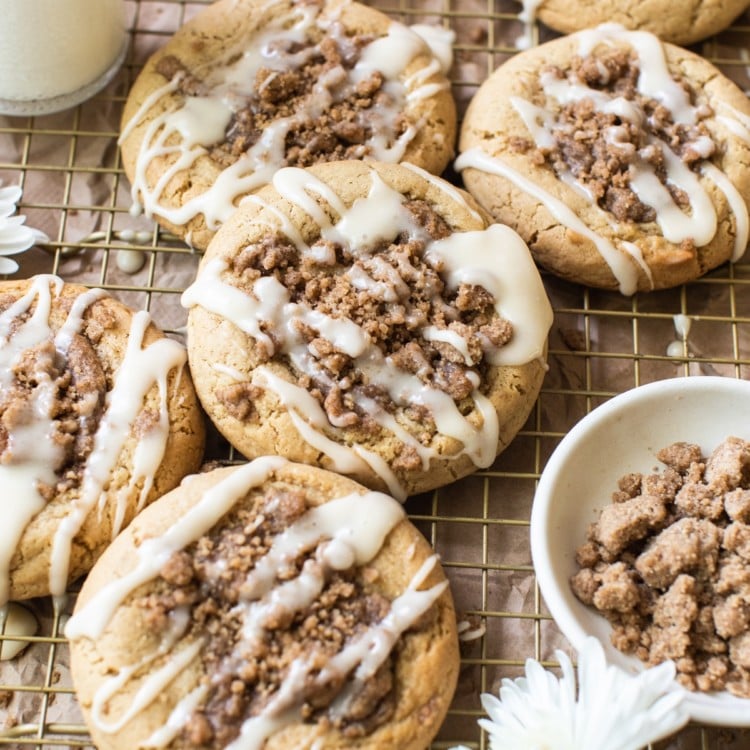 coffee cake cookies on a gold cooling rack with icing on top of the cookies
