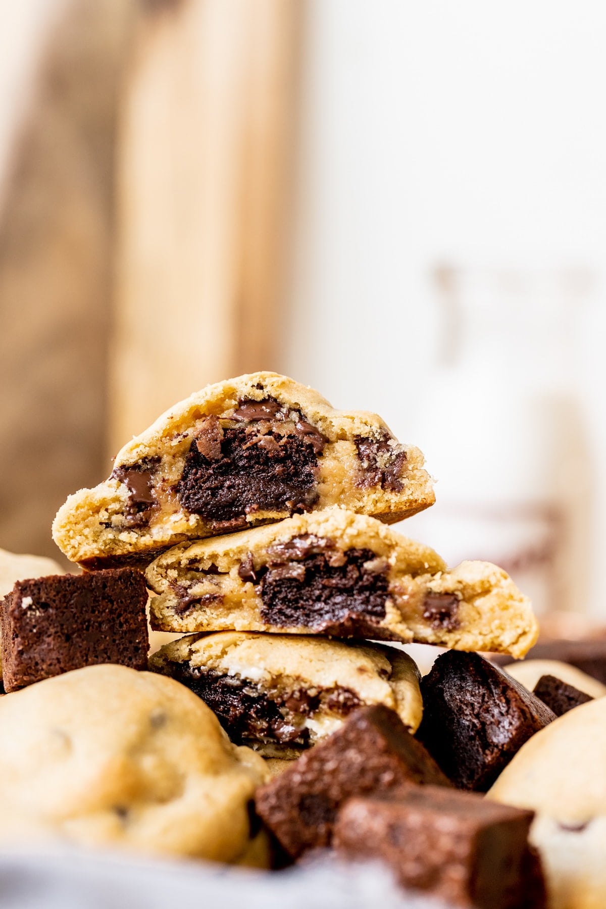 cookies stacked on top of each other with brownies stuffed in the center.