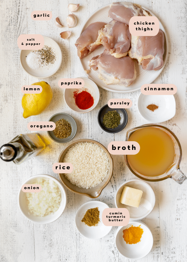 ingredients to make chicken and rice in small white glass bowls 