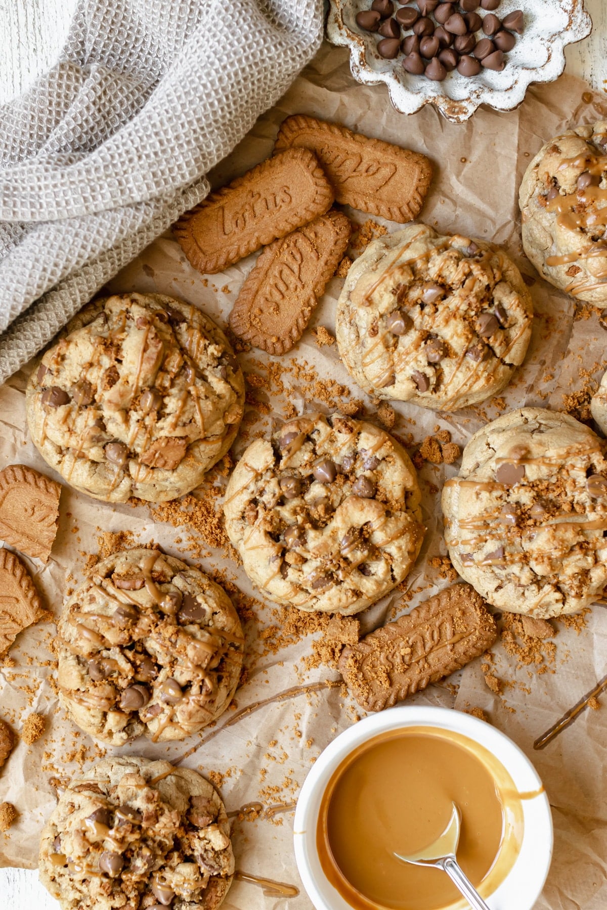 cookies on parchment paper drizzled with cookie butter.