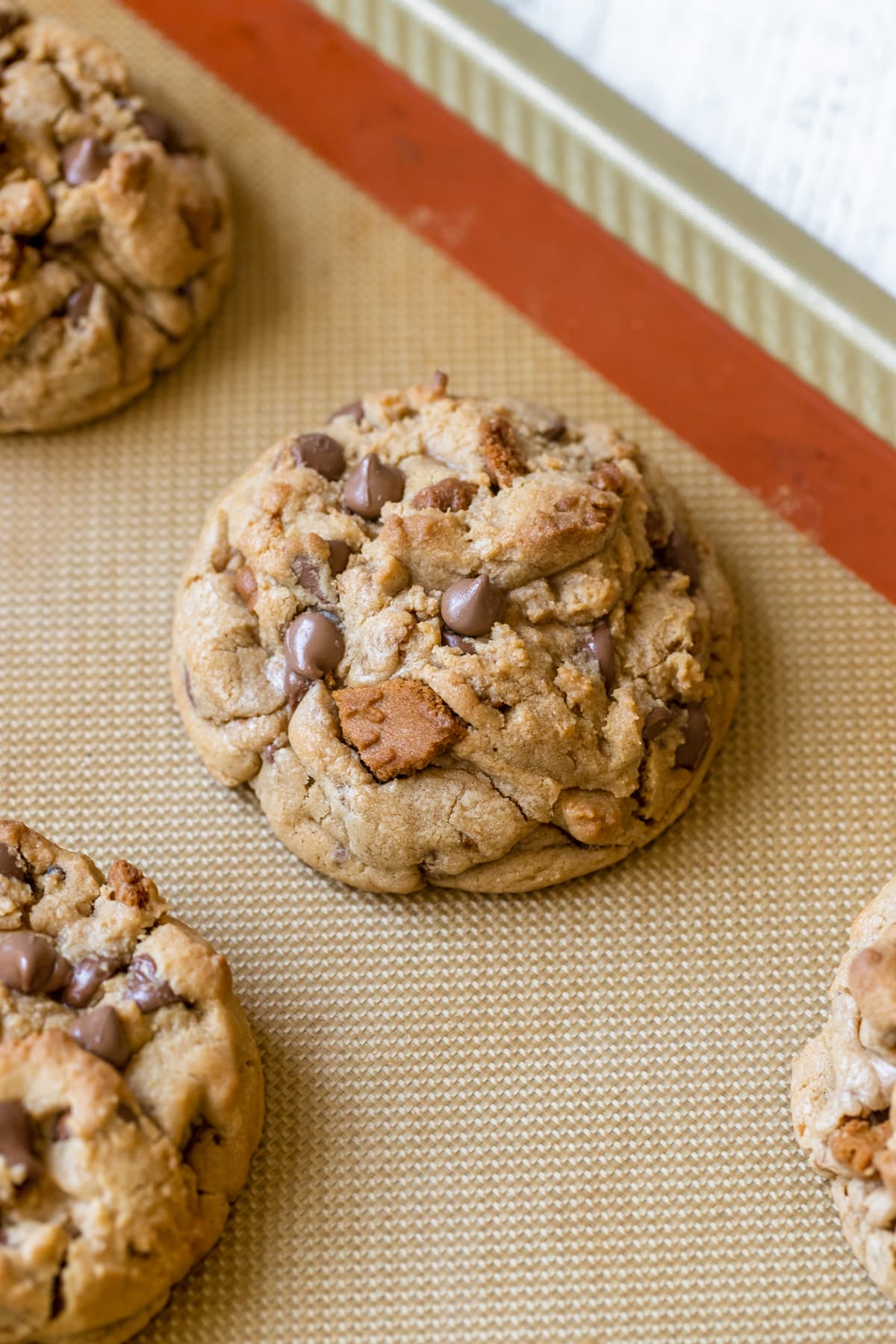 a cookie on a silicone baking mat.