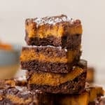 a brownie with a bite taken out of it topped with flaky sea salt.