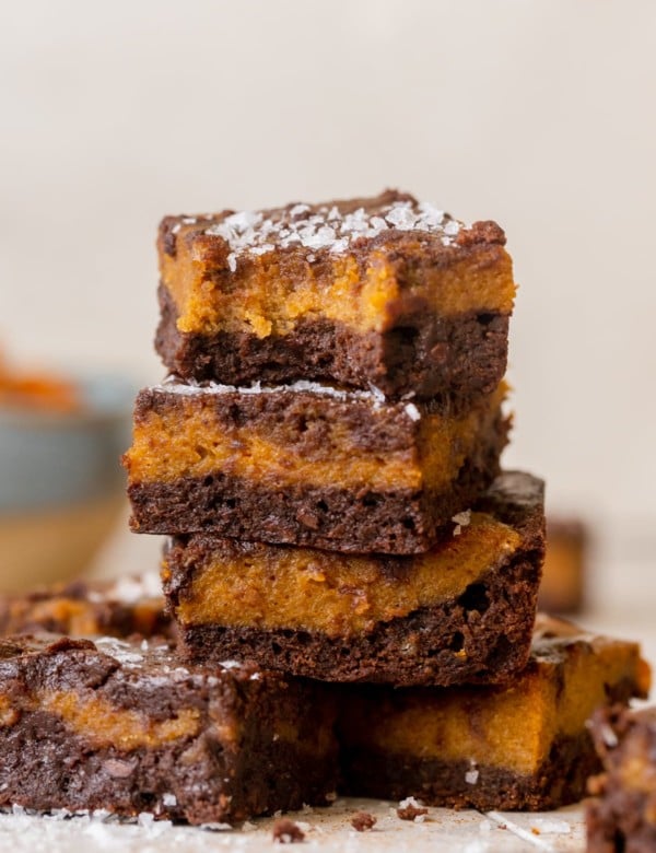 a brownie with a bite taken out of it topped with flaky sea salt.