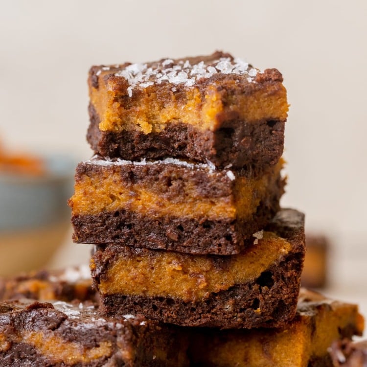 a brownie with a bite taken out of it topped with flaky sea salt.