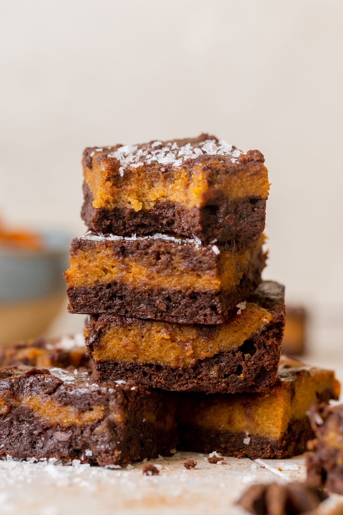 a brownie with a bite taken out of it topped with flaky sea salt.