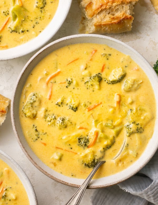 soup in a white soup bowl with bread on the side.