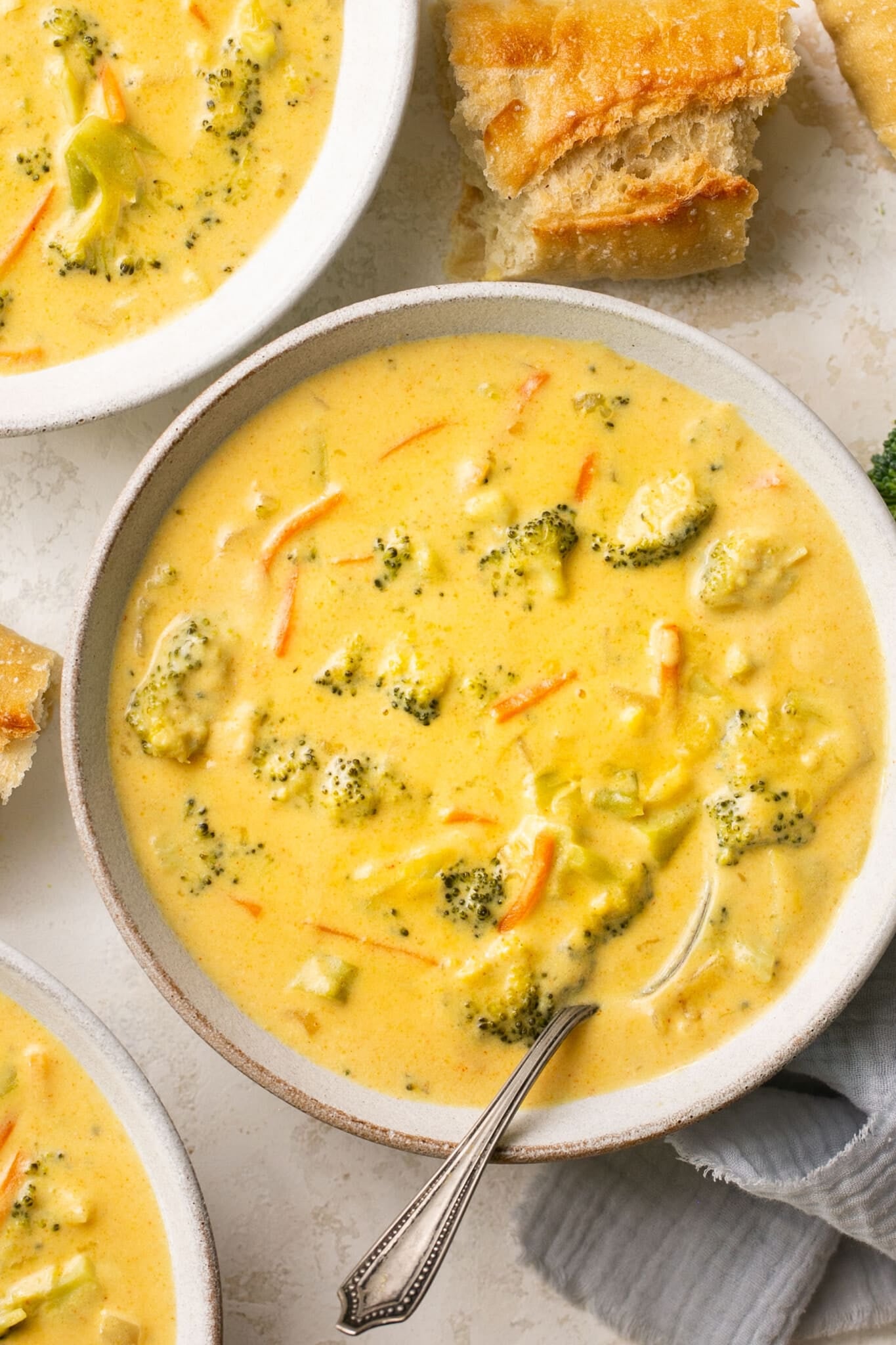 soup in a white soup bowl with bread on the side.