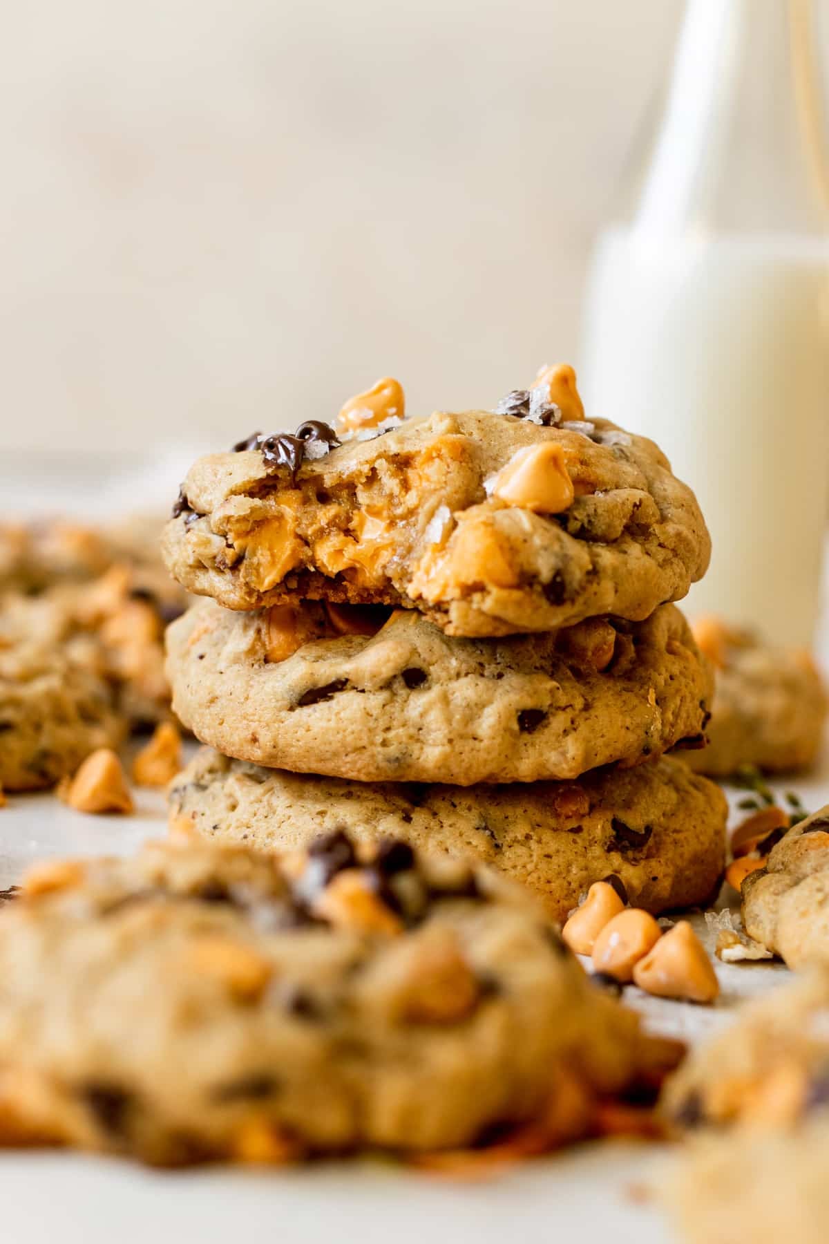 cookies stacked on top of each other and one of the cookies has a bite taken from it.