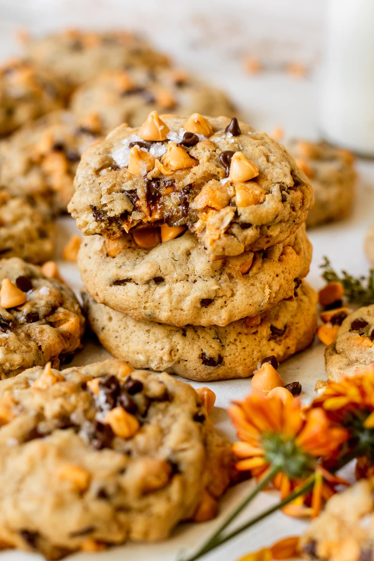 cookies stacked on top of each other and one of the cookies has a bite taken from it.
